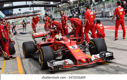 KUALA LUMPUR, MALAYSIA - OCTOBER 1, 2017 : Sebastian Vettel (Germany) Making A Pitstop In The Scuderia Ferrari SF71H F1 2018 Car During The F1 At Sepang Circuit.