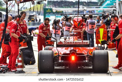 KUALA LUMPUR, MALAYSIA - OCTOBER 1, 2017 : Sebastian Vettel (Germany) Making A Pitstop In The Scuderia Ferrari SF71H F1 2018 Car During The F1 At Sepang Circuit.