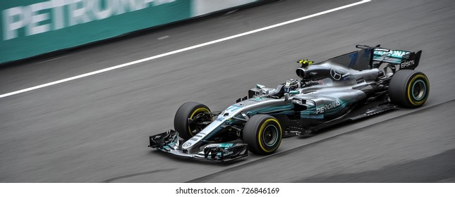 KUALA LUMPUR, MALAYSIA -OCTOBER 1, 2017 : Valtteri Bottas of Great Britain Mercedes AMG Petronas F1 Team on track with slow motion technic during Malaysia Formula One Grand Prix at Sepang Circuit 
