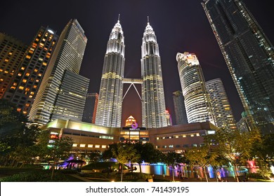 Kuala Lumpur, Malaysia : October 17, 2017 - Beautiful colorful musical fountain at night with background of Petronas Twin Tower and Suria KLCC. Petronas Twin Tower is the tallest building in Malaysia