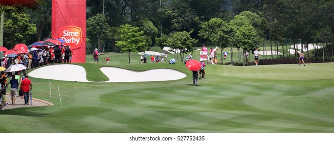 KUALA LUMPUR, MALAYSIA - OCTOBER 29, 2016: Spectators Watch Jang Hana, Anna Nordqvist And Michelle Wie Play At The 9th Hole Green Of The TPC At The 2016 Sime Darby LPGA Malaysia Golf Tournament.