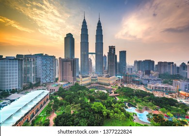 Kuala Lumpur, Malaysia park and skyline at dusk.
