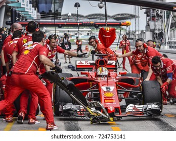 KUALA LUMPUR, MALAYSIA - SEPTEMBER 28, 2017 : Mechanics attend to Ferrari's Finnish driver Sebastian Vettel car during Malaysia Formula One Grand Prix at Sepang Circuit.