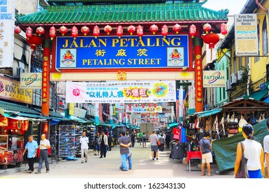 KUALA LUMPUR - MAY 11: Petaling Street On May 11, 2013 In Kuala Lumpur. The Street Is A Long Market Which Specializes In Counterfeit Clothes, Watches And Shoes. Famous Tourist Attraction 