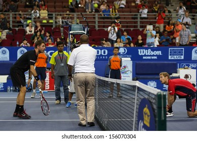 KUALA LUMPUR - SEPTEMBER 27: Stan Wawrinka And Dimitry Tursunov Views The Coin Toss At A Quarter-final Match Of The Malaysia Open 2013 Tennis At The Putra Stadium, Malaysia On September 27, 2013.