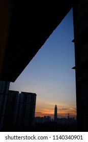 Kuala Lumpur Skyline During Sunset Scenery With A Building Silhoutte And Black Building Framing Around With Orange And Blue Colour