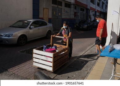 Kuala Lumpur,25 January 2021,Malaysia-
A Woman Push A Cart Selling Her Local Food Nasi Lemak In Kuala Lumpur.