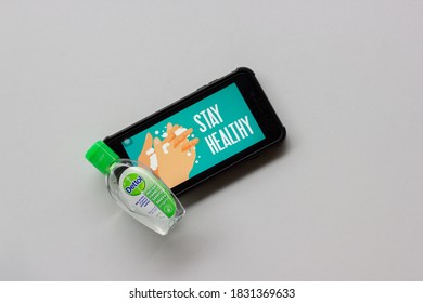 Kuala Lumpur,Malaysia - October 12 2020 : Smart Phone Showing Stay Healthy Logo. Covid-19 Coronavirus Stay Home Concept