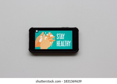 Kuala Lumpur,Malaysia - October 12 2020 : Smart Phone Showing Stay Healthy Logo. Covid-19 Coronavirus Stay Home Concept