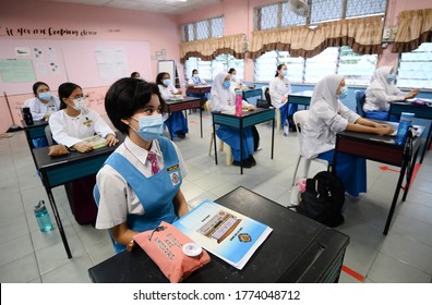 Kuala Lumpur/Malaysia-June 24 2020:
Students Wearing Face Masks And Maintaining  Social Distancing At A Classroom On The First Day Of School Reopening At A High School In Kuala Lumpur.