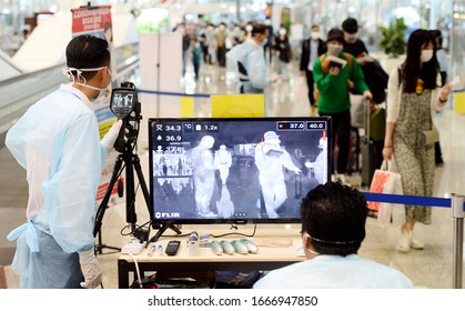 Kuala Lumpur/Malaysia-March 05,2020.
Malaysian Health Ministry Officers Use A Thermal Scanner To Check The Temperatures Of Passengers Arriving At The Kuala Lumpur International Airport.