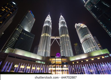 KUALA LUMPUR,MALAYSIA-MAY 15 2017:The Kuala Lumpur City Center of KLCC views from low angle at night with colourful water fountain on the park