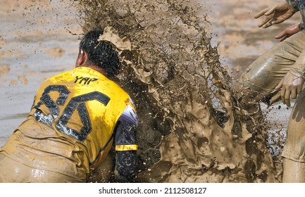 Kuala Pilah, Malaysia - December 11th 2021: Muddy Water Splash Over Player's Face During 'Ngoca' Football Festival In Malaysia.