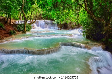 Kuang si waterfall is the biggest & most gorgeous falls in Luang Prabang. The purity water & the glamour of nature make this waterfall well-known & attract people from all around the world to visit. - Shutterstock ID 1414205705
