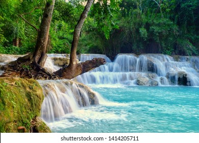 Kuang si waterfall is the biggest & most gorgeous falls in Luang Prabang. The purity water & the glamour of nature make this waterfall well-known & attract people from all around the world to visit. - Shutterstock ID 1414205711