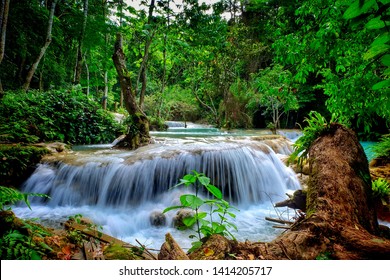 Kuang si waterfall is the biggest & most gorgeous falls in Luang Prabang. The purity water & the glamour of nature make this waterfall well-known & attract people from all around the world to visit. - Shutterstock ID 1414205717