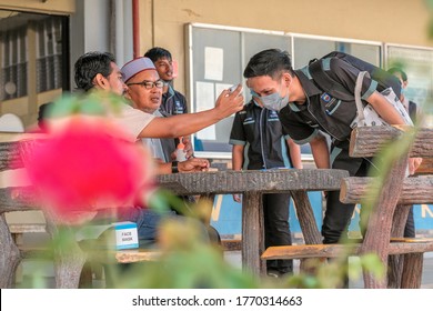 Kuantan, Malaysia - July 5th,2020 : Teacher Using Thermometer Temperature Screening Student For Fever Against The Spread Of COVID-19 While Student Coming Back To School, Education Concept.