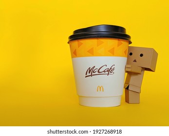 Kuantan, Malaysia - Mac 1, 2021: Mc Cafe Hot Latte Cup Isolated Over Yellow Background