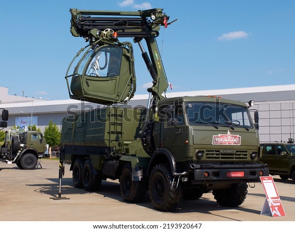 KUBINKA, RUSSIA, AUG.18, 2022: Special\
military truck for air planes icing protection with cabine and\
tescopic arm on Kamaz cross country off road truck\
chassis