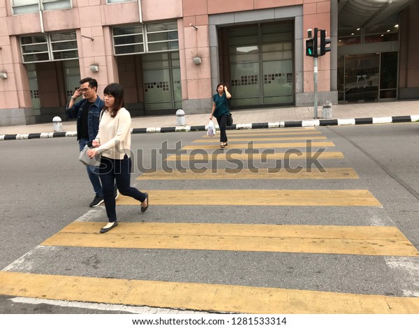 Kuching 12 Jan 2019 Zebra crossing for crosswalk\
pedestrian. Driver must follow the rules to give a way for those\
pedestrian to avoid\
accident