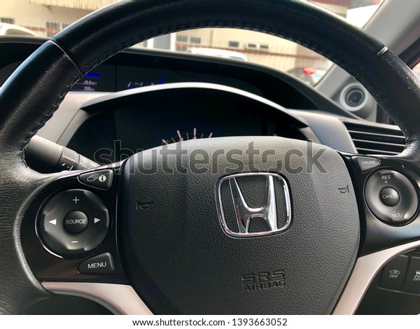 Kuching, Malaysia - April\
2019. Closed up shot of Honda Logo at steering wheel, interior of\
Honda Civic.