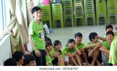 Kuching, Malaysia - August 4, 2012:The Photo Showing A Young Teenager Giving A Short And Casual Presentation Or Discussion In Front Of People During Ice Breaker Game.                          