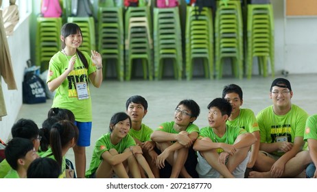 Kuching, Malaysia - August 4, 2012:The Photo Showing A Young Teenager Giving A Short And Casual Presentation Or Discussion In Front Of People During Ice Breaker Game.                          