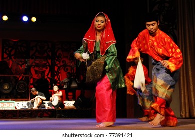KUCHING, MALAYSIA - MAY 14: Ethnic Malays from Borneo island performs the zapin dance at the Sarawak Cultural Village, May14, 2010 in Kuching. The zapin dance is performed at weddings and joyous celebrations.