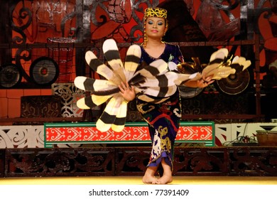 KUCHING, MALAYSIA - MAY 14: Young Girl Of The Indigenous Native Orang Ulu People From The Borneo Island Performs A Traditional Dance At The Sarawak Cultural Village, May14, 2010 In Kuching.