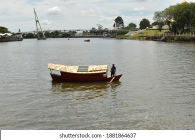 Kuching, Malaysia - May 20 2019: Boat Cruising Along Kuching River