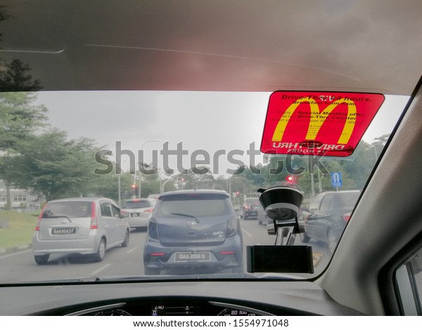 KUCHING,\
MALAYSIA - NOVEMBER 9th, 2019: McDonald\'s VIP sticker pasted on\
right corner of car windshield.  Drive-Thru customers enjoy an\
exclusive offer every month. Selective focus.\
