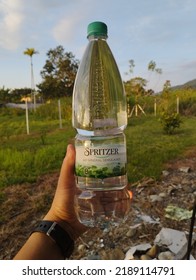 Kudat, Sabah Malaysia, August 12,2022.A Well-known Bottled Mineral Water Spritzer With New And Attractive Packing In A Human Hand.