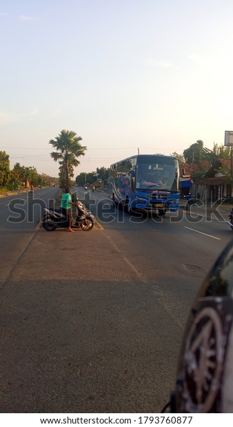 Kudus, Central\
Java, Indonesia - 11 August 2020. despite the pandemic, bus\
transportation services are still\
running.