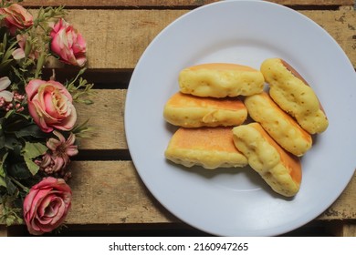 Kue Pukis (Pukis Cake) Original Flavor On A White Plate And Wooden Table