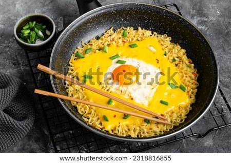 Kujirai Ramen, Shin Ramyeon or Ramyun with Egg, Melted Cheese and Scallion, Instant Noodles on Dark Background
