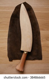 kukr a knife with the wooden handle and wood sheath