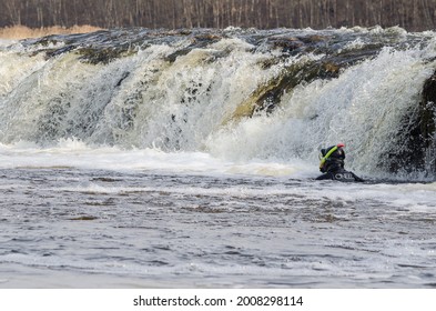 Kuldiga, Latvia - April 1, 2017: The Diver Is Looking For Hidden Illegal Fishing Nets In The Venta River And Under The Waterfall.