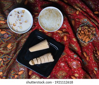 Kulfi Falooda On Black Plate With Milk And Falooda In Bowl On Colourful Background