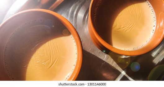 A kulhar or kulhad cup (traditional handle-less clay cup) from North India filled with hot Indian tea.