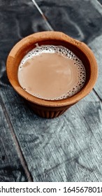A kulhar or kulhad cup (traditional handle-less clay cup) from North India filled with hot Indian tea