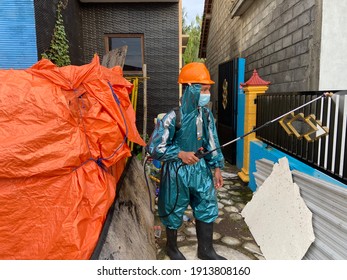 KULON PROGO, INDONESIA - February 10th, 2021 - A Worker Is Spraying Disinfectant In His Work Area To Prevent The Spread Of The Corona Virus.