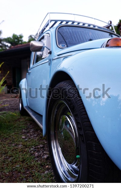 kulon progo,yogyakarta - may 11 2019: vw bug or\
volkswagen beetle in blue\
color