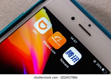 Kumamoto, JAPAN - Aug 10 2021 : Concept Image Of DiDi, Alibaba And Tencent Icons On IPhone On White Table.