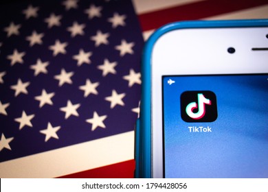 Kumamoto, Japan - Aug 11 2020 :
Concept Image Of TikTok, A Chinese Video-sharing SNS By ByteDance In Beijing, On IPhone On US Flag. President Trump Signs Executive Order, Essentially Banning TikTok