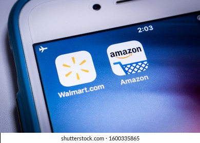 Kumamoto, Japan - Dec 13 2019:
Walmart & Amazon, two big giants of US retail industry, on an iPhone. 
Due to down of consumers shopping on Amazon in recent years, Walmart appears to show its presence.