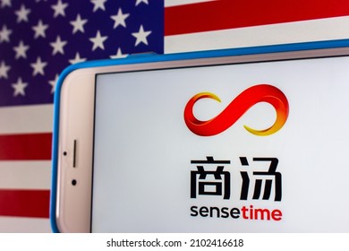 Kumamoto, JAPAN - Dec 14 2021 : The Logo Of SenseTime, A Hong Kong Based Leading Artificial Intelligence Software Company, On IPhone On US Flag