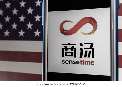 Kumamoto, JAPAN - Dec 14 2021 : The Logo Of SenseTime, A Hong Kong Based Leading Artificial Intelligence Software Company, On IPhone On US Flag In Retro Mood.