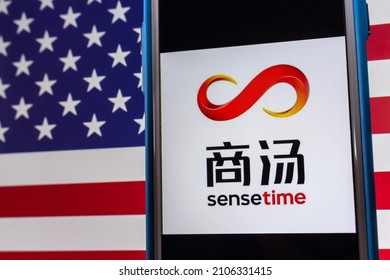 Kumamoto, JAPAN - Dec 14 2021 : The Logo Of SenseTime, A Hong Kong Based Leading Artificial Intelligence Software Company, On IPhone On US Flag