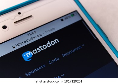 Kumamoto, JAPAN - Feb 8 2021 : Mastodon logo, free open-source software for running self-hosted social networking services (it has microblogging features similar to Twitter), on its website on iPhone