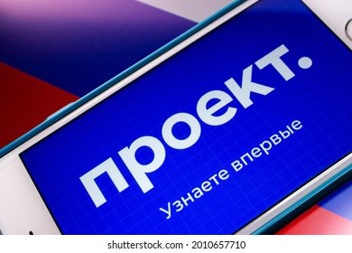 Kumamoto, JAPAN - Jul 19 2021 : Closeup logo of Proekt Media, an independent Russian media specializing in investigative journalism, in its website on iPhone on Russian Flag background